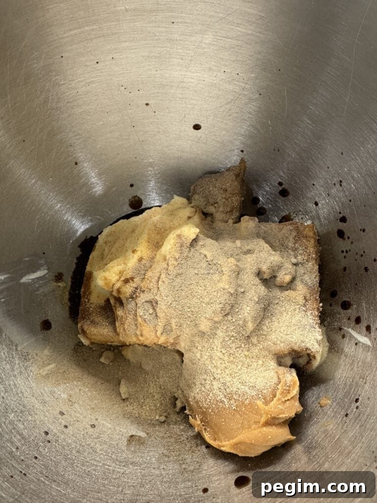 The dip ingredients in a metal mixing bowl