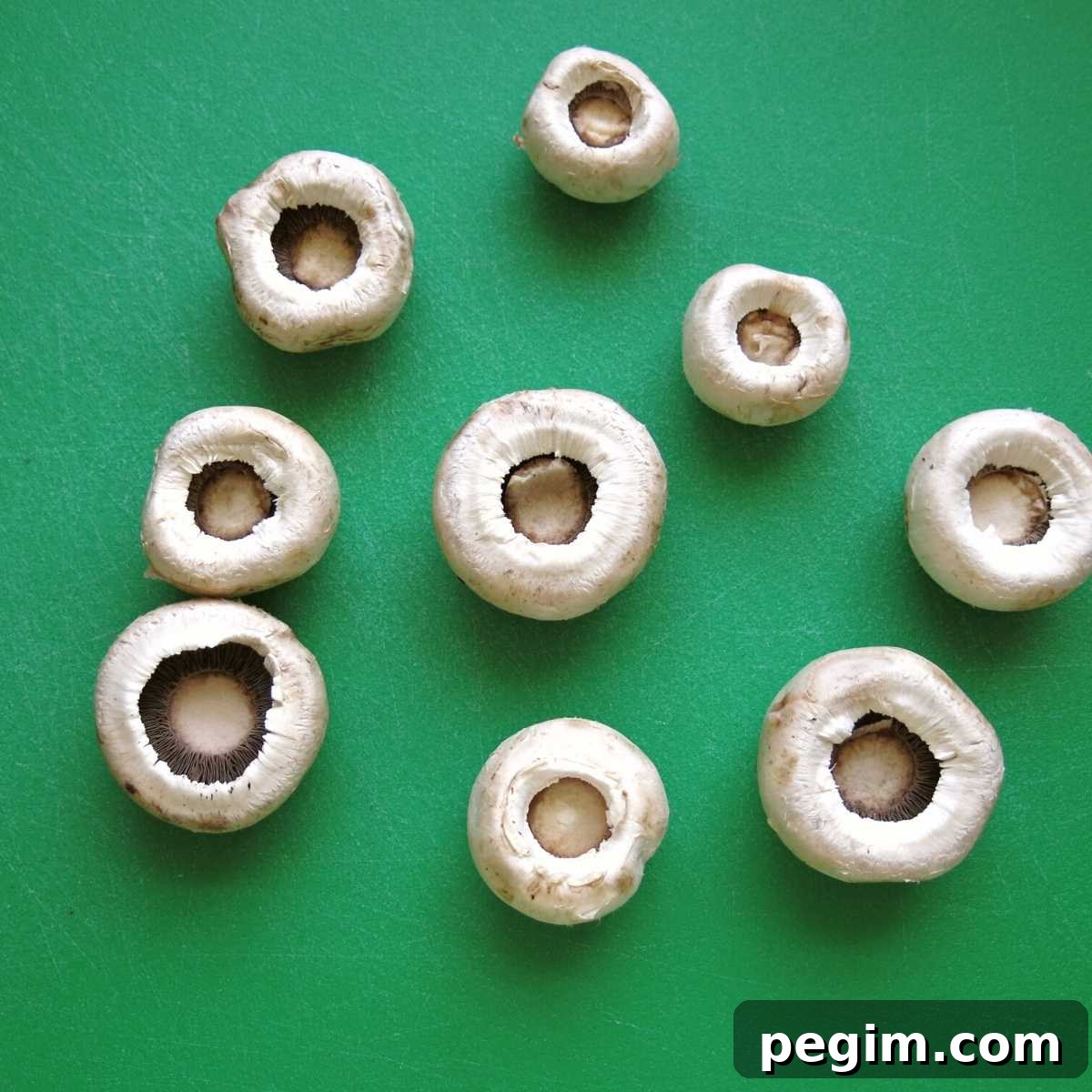 Mushroom caps with stems removed.