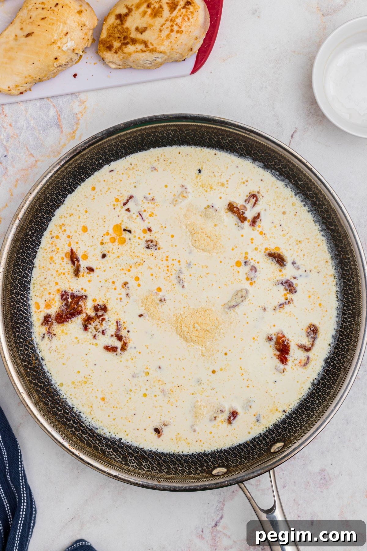 Cream and cheese added to skillet. 