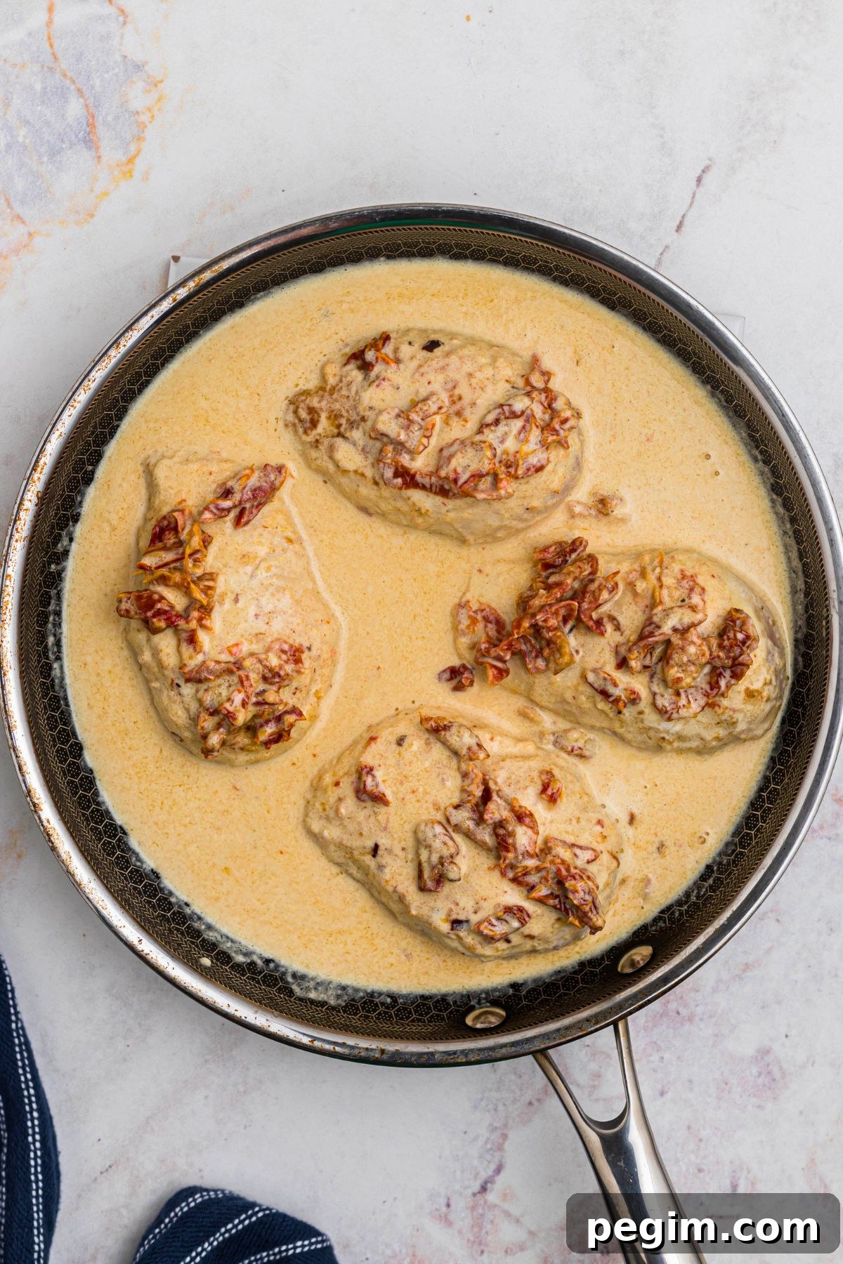 All ingredients added to skilled with chicken on top before finishing cooking the chicken. 