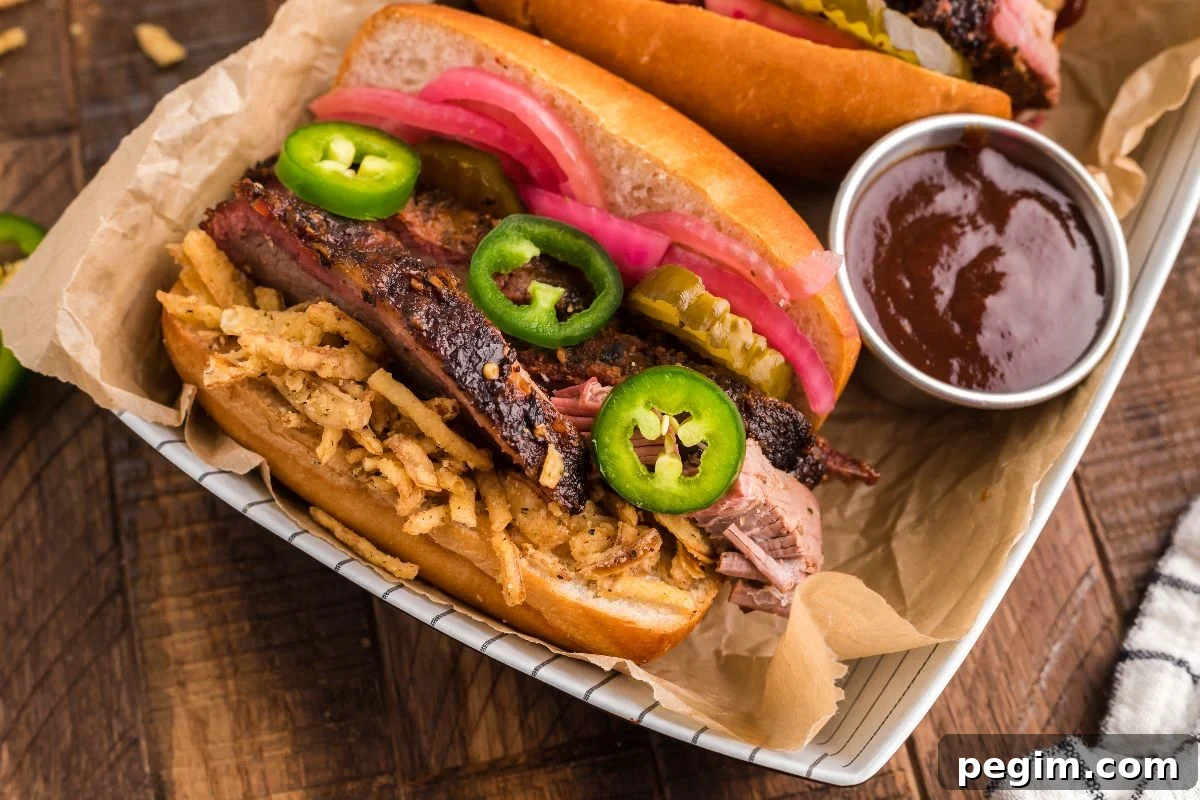 Enjoy the best BBQ brisket sandwich topped with fried onions, jalapeños, pickles, and pickled onions, served with savory barbecue sauce.