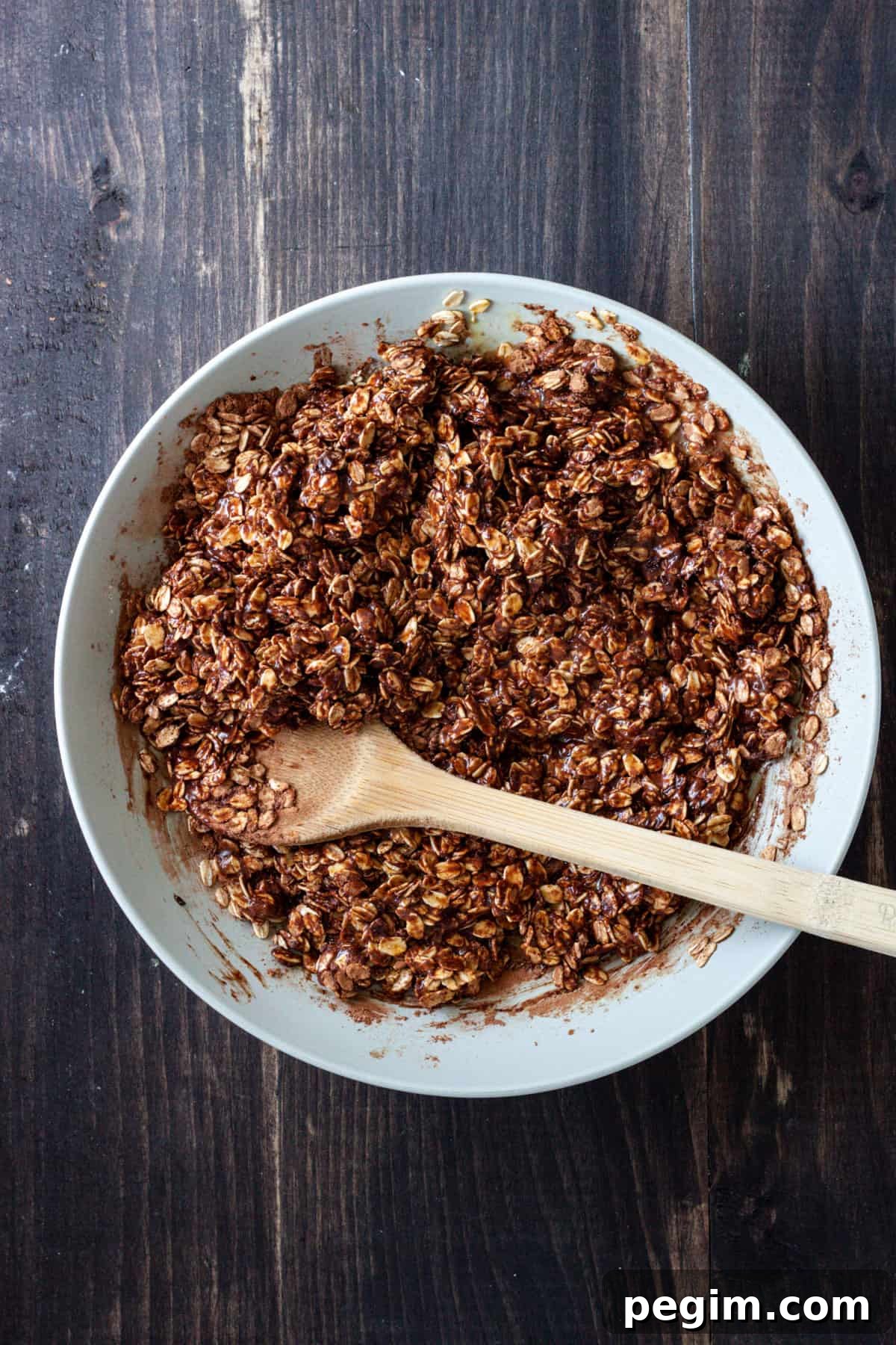 Chocolate baked oatmeal without milk in a mixing bowl.