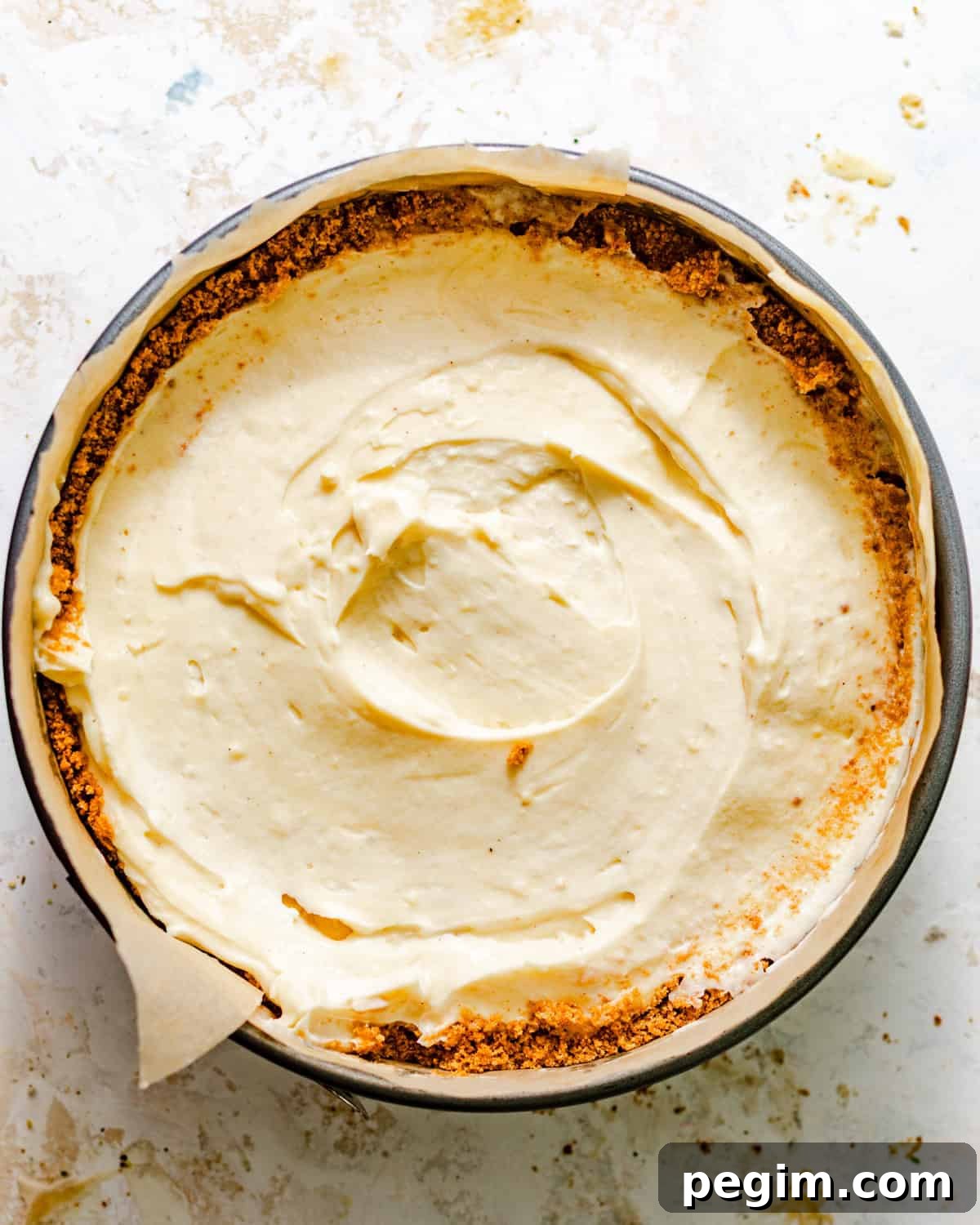 banana cream pie in a springform pan with the remaining filling added on top to cover the bananas.