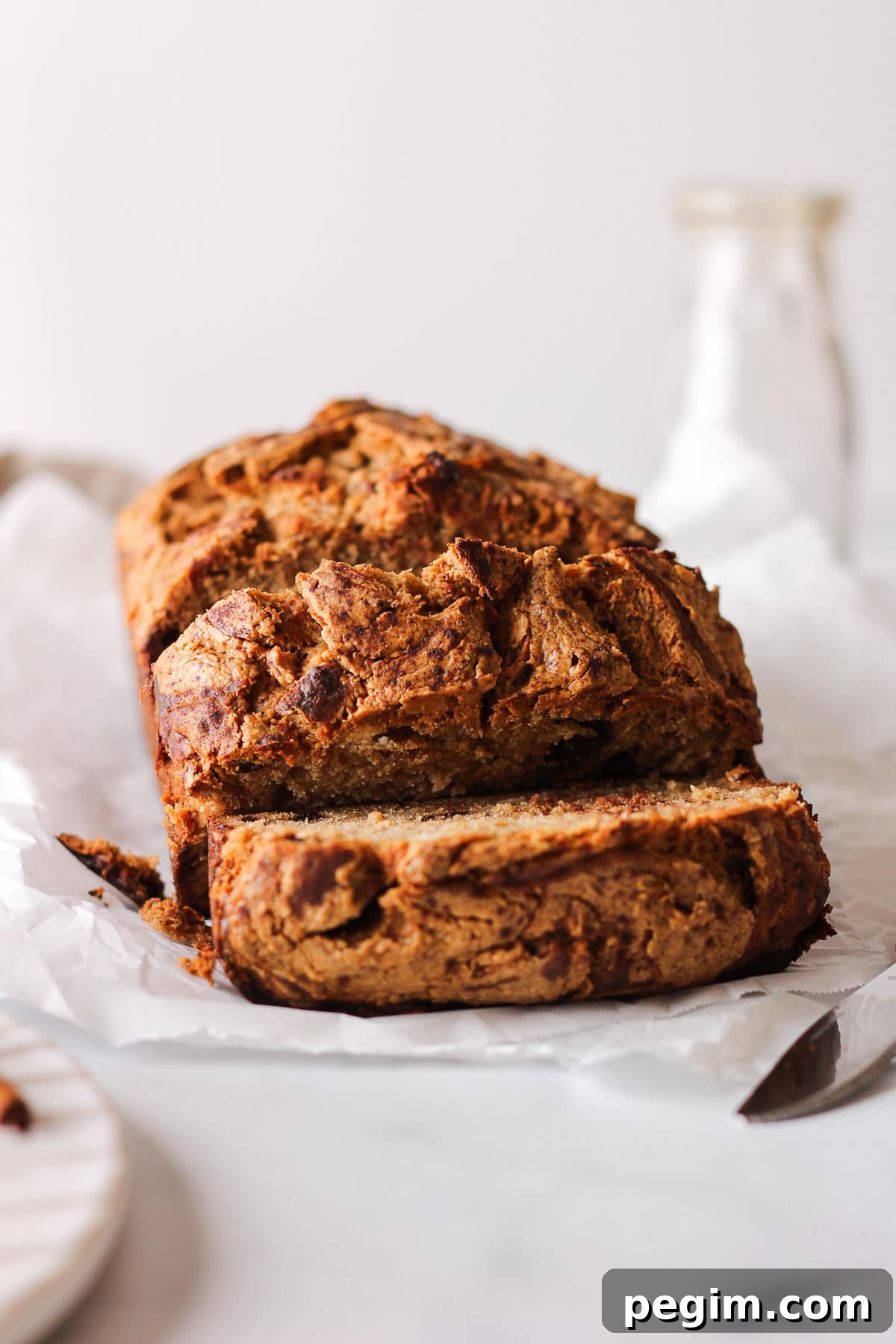 sliced loaf of peanut butter banana bread for baking blog and food photography