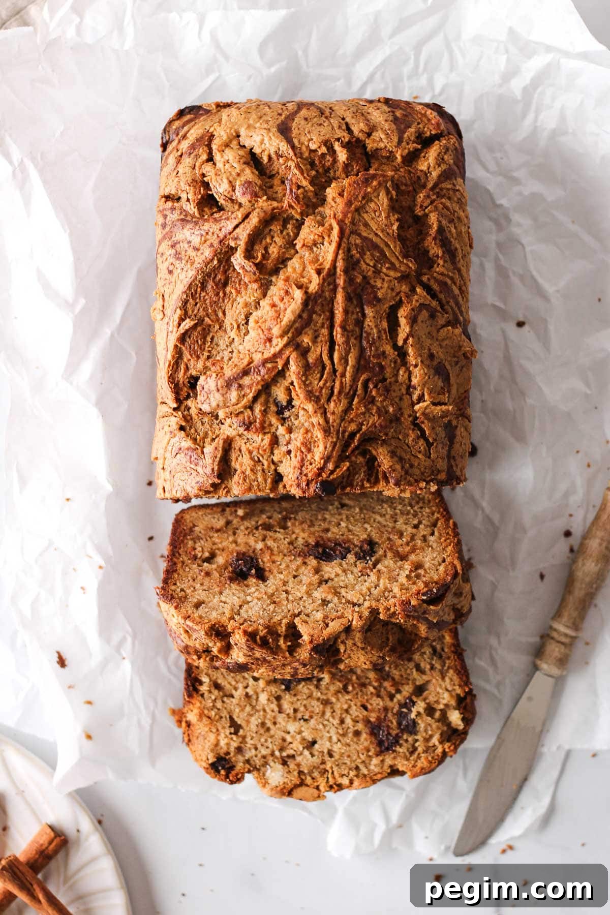 sliced loaf of nut butter banana bread for baking blog and food photography