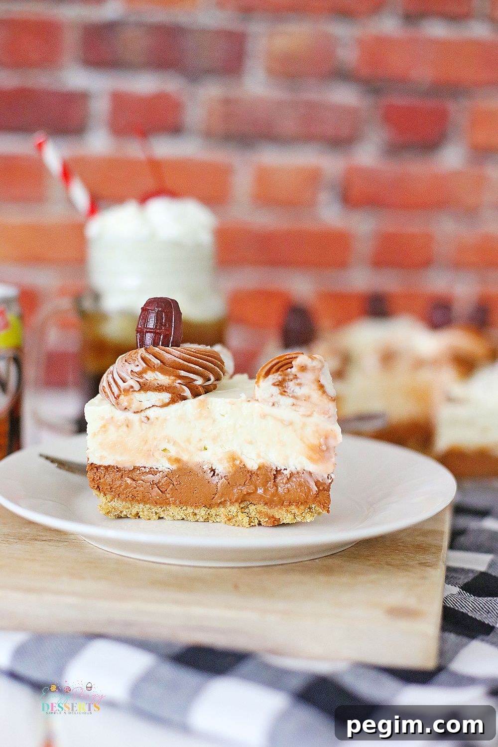 Front image of a slice of root beer float cheese on a dessert plate