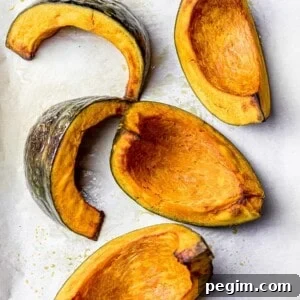 golden brown roasted kabocha squash wedges on parchment paper