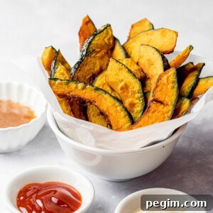 kabocha squash fries in a white bowl with ketchup and condiments