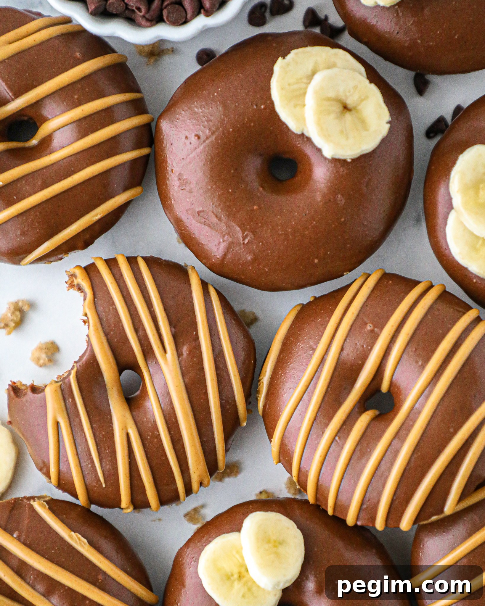 Pancake mix donuts made with bananas and a few other simple ingredients! This is such a fun recipe for a lazy weekend brunch or an easy week day breakfast!