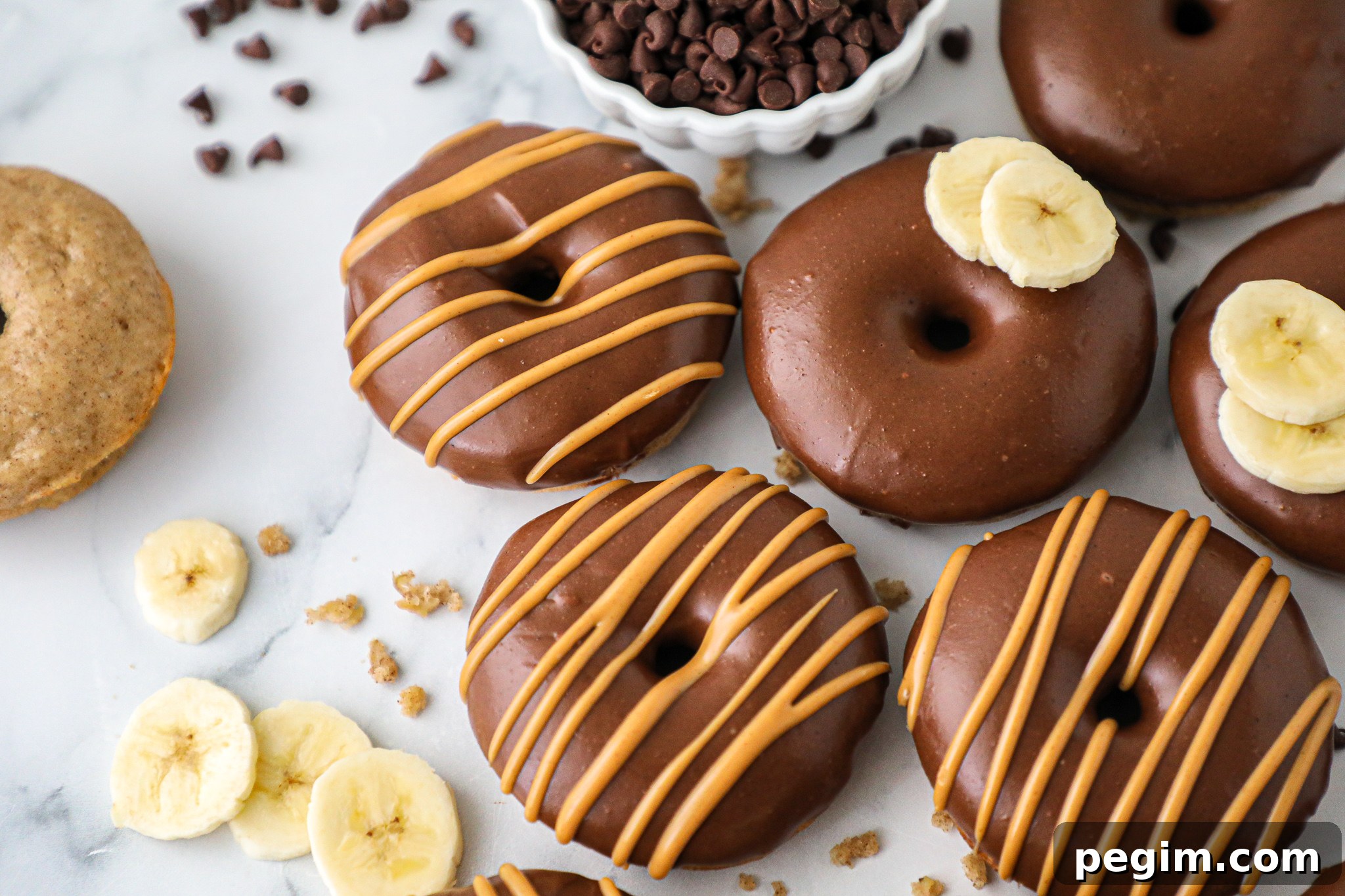 Banana pancake donuts are light and fluffy and pair perfectly with chocolate peanut butter frosting.