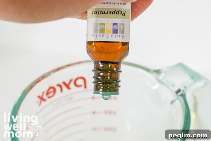 adding peppermint essential oil to chapstick mix
