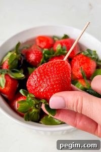 skewer stuck into fresh strawberry.