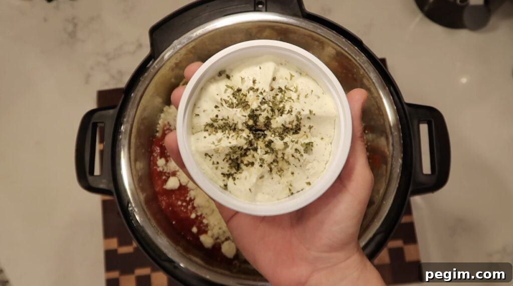 Adding herb cheese to pot