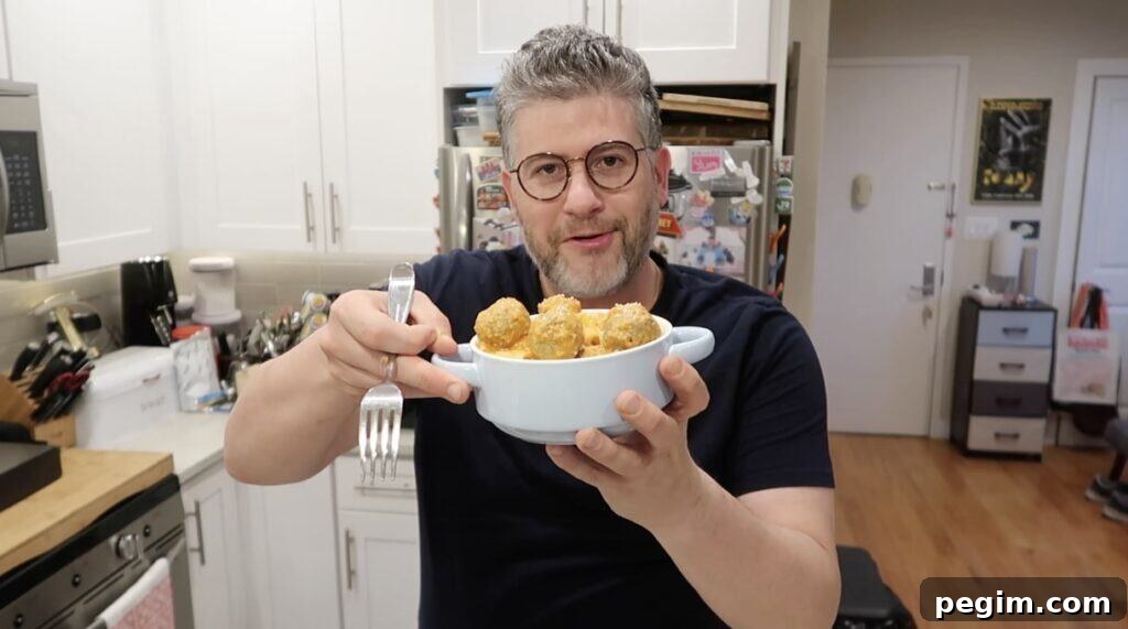 Man holding bowl of pasta