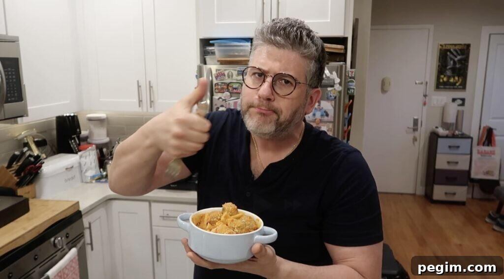Man giving thumbs up with pasta