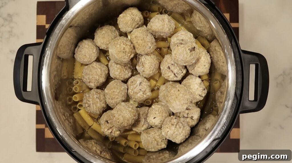 Topping pasta with frozen meatballs