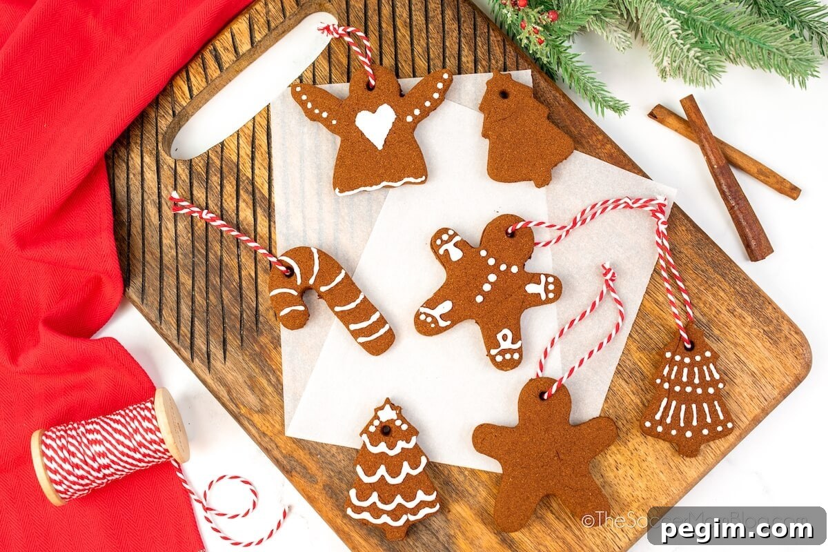 wooden board with an array of homemade cinnamon Christmas ornaments.