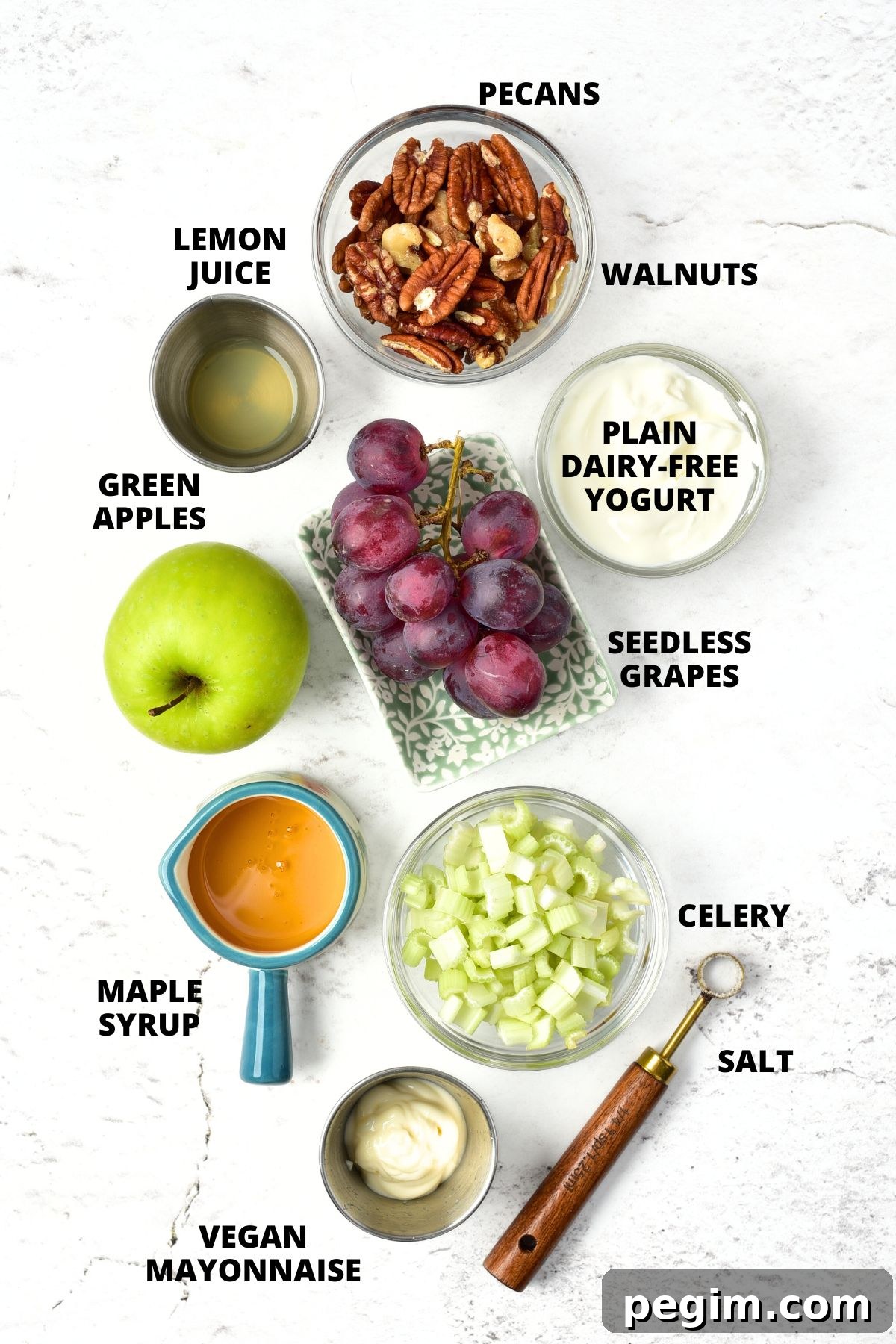 Ingredients for vegan waldorf salad recipe laid out on white board