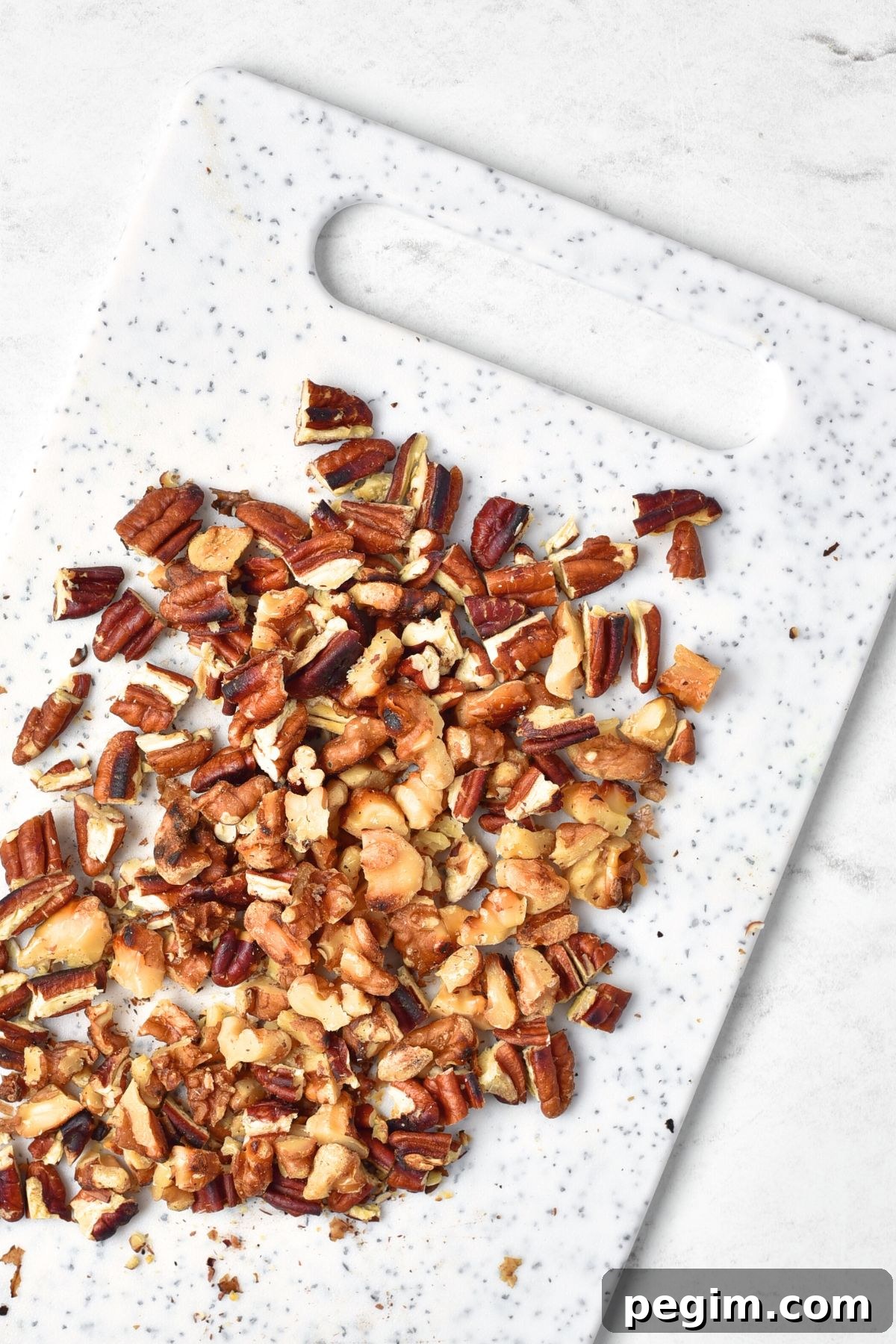 Chopped nuts on chopping board