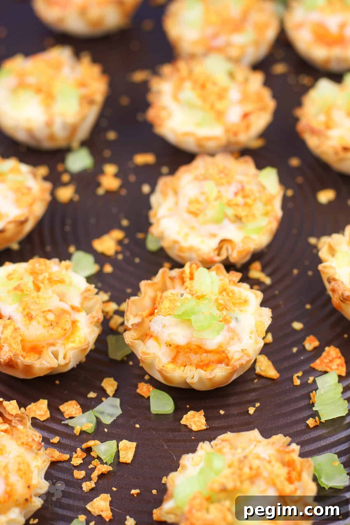 filled mini phyllo cups on bake sheet