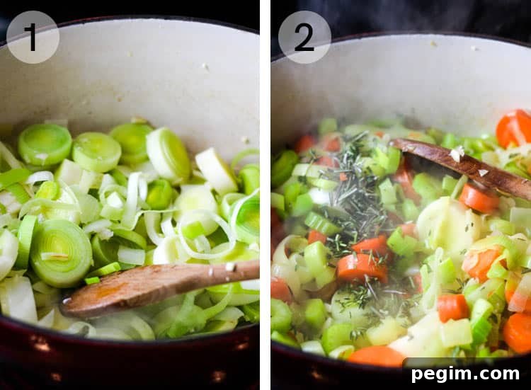 Leeks and carrots being sauteed in a dutch oven
