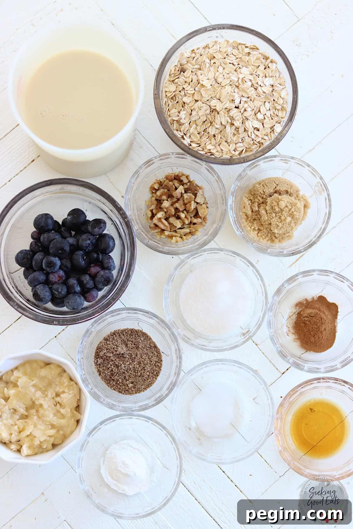 Baked oatmeal vegan ingredients on a white wooden board.