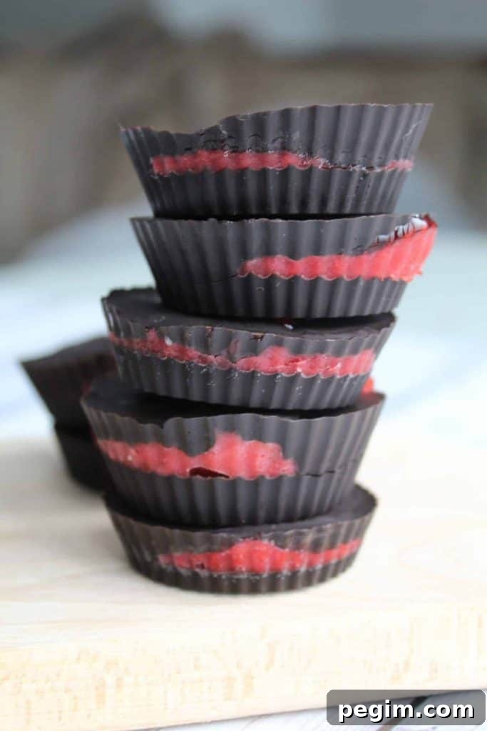 chocolate strawberry fat bombs on a counter