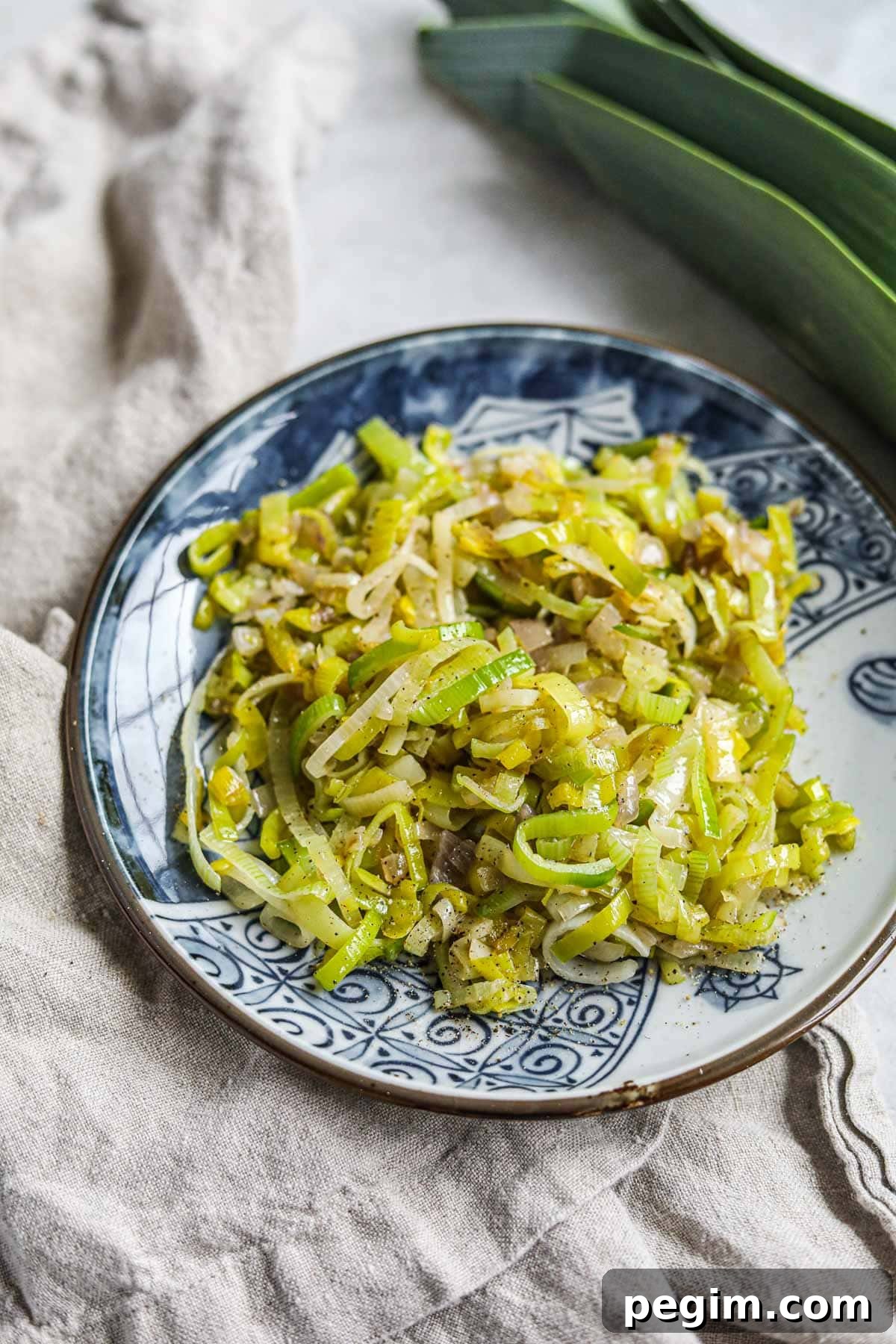 20 Delicious Side Dishes to Serve with Roasted Chicken 17 Sautéed buttered leeks with shallots on a plate.