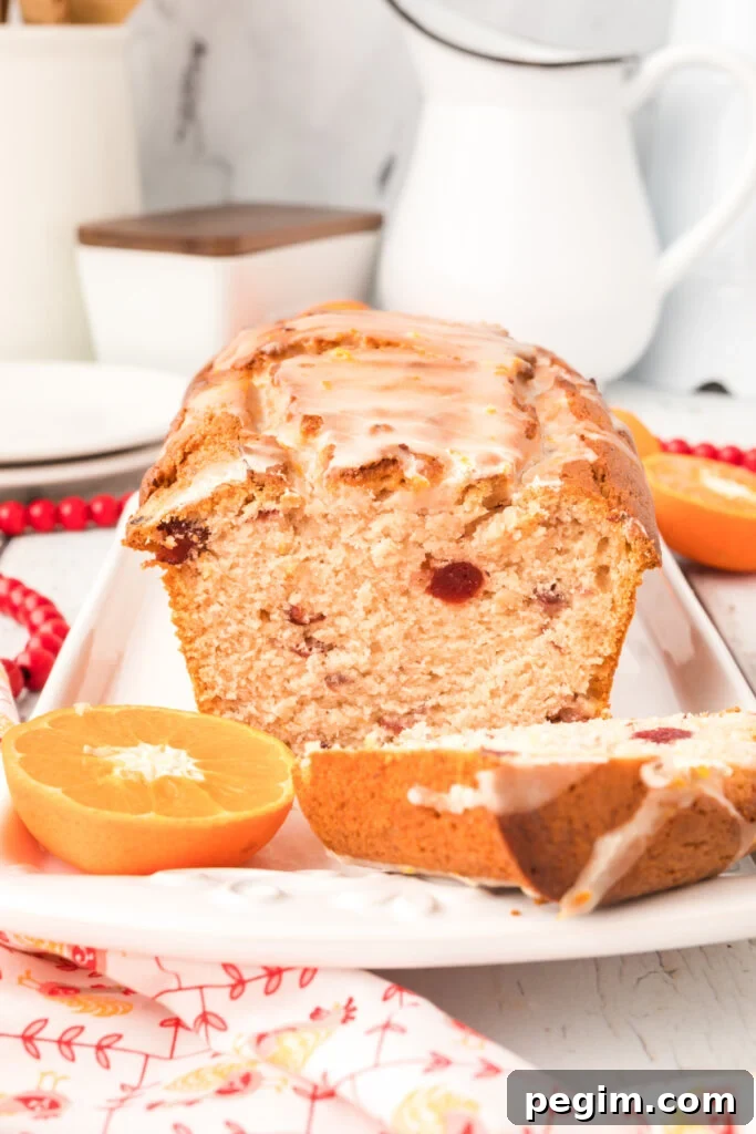 loaf of orange cranberry bread sliced open