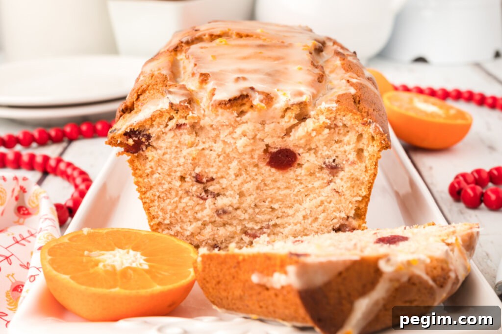 loaf of glazed orange cranberry quick bread