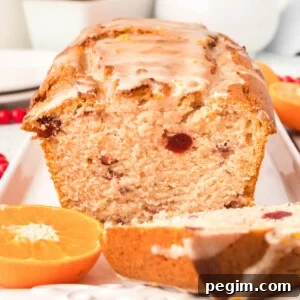 cut loaf of orange cranberry bread