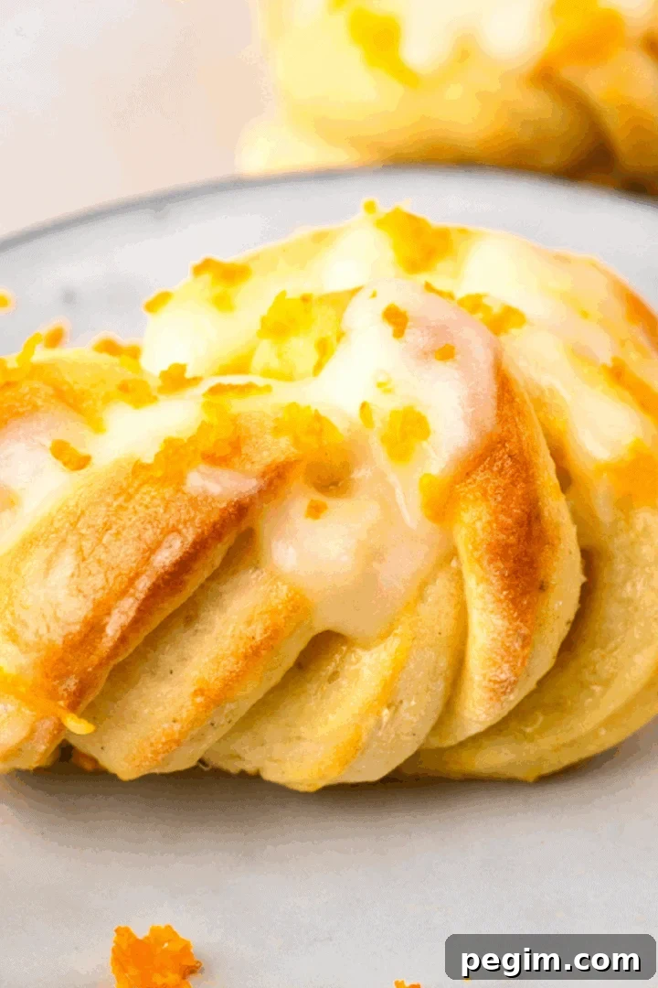 up close image of gluten free orange knots on a plate or orange zest on top