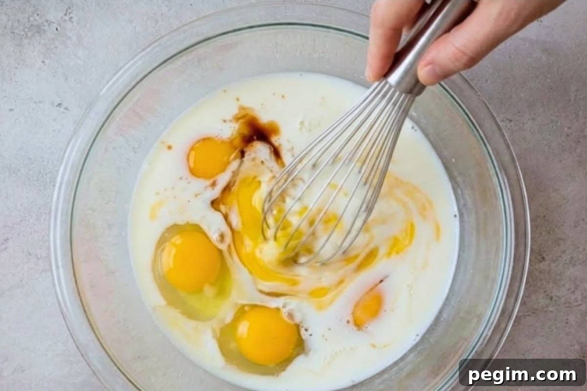 Beat together eggs, milk, and vanilla 