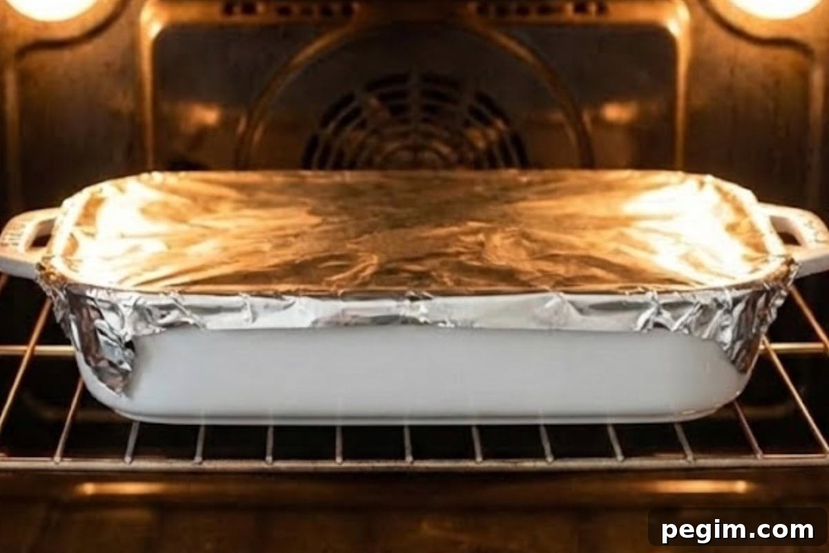 Remove from fridge 20 minutes before baking, then bake covered at 350° F for 30 minutes