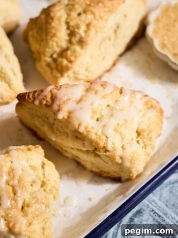 Sourdough Discard Scones drizzled with glaze.