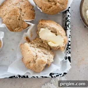 Sourdough Discard Banana Muffins on white parchment paper.