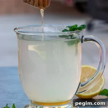 Square image of honey lemon tea.