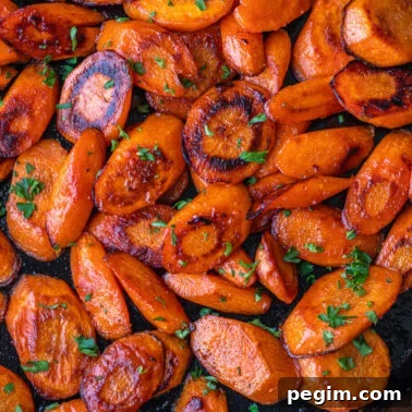 Square image of cooked carrots.