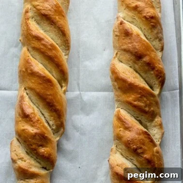 French bread loaves on large baking sheet