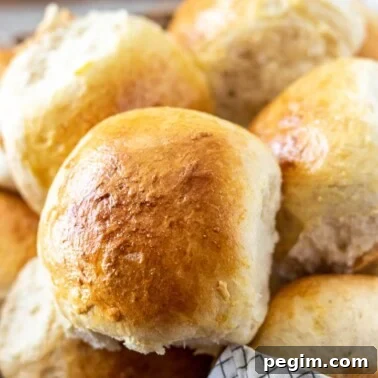 close up of a dinner roll in a basket