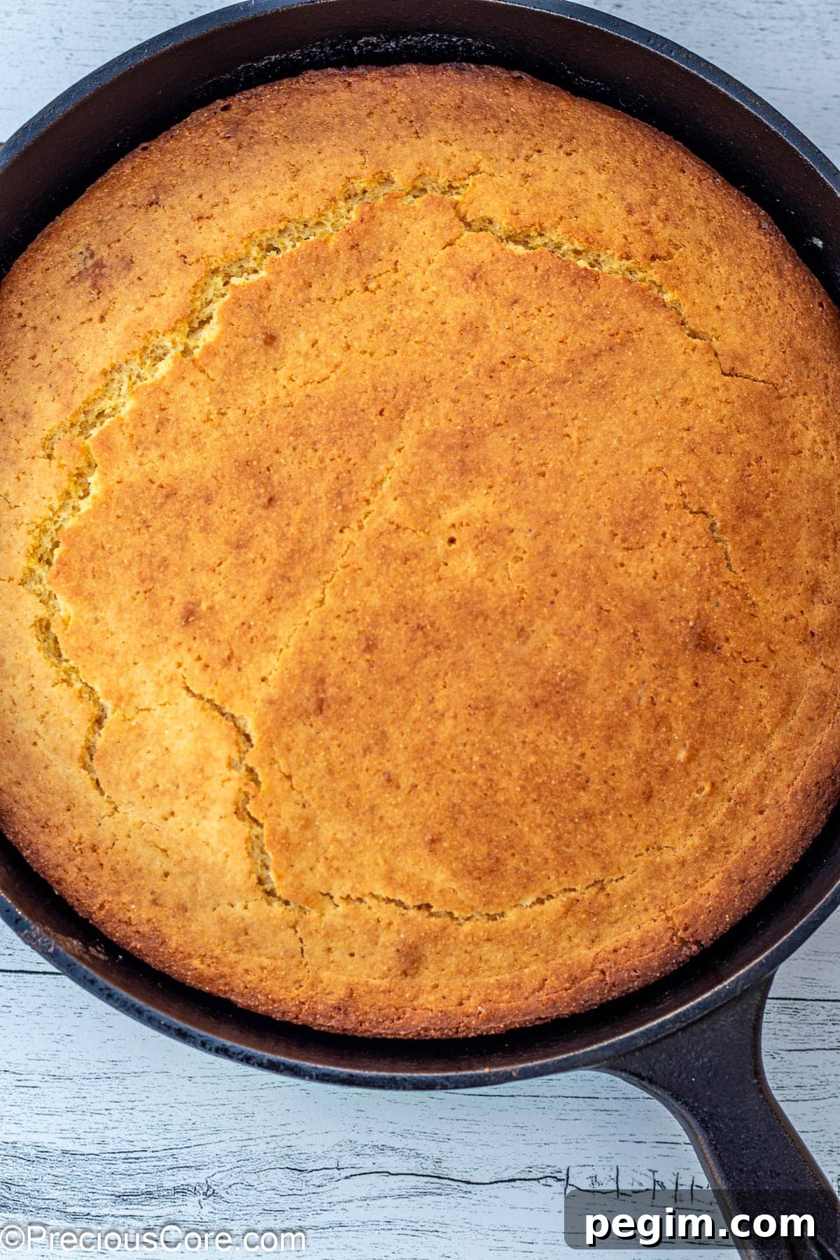 Baked cornbread in cast iron skillet.