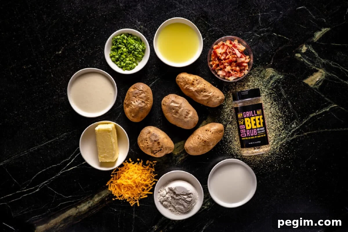 Five uncooked potatoes on a counter surrounded by bowls of liquids and chopped veggies, a pile of shredded cheese, and a bottle of Hey Grill Hey Beef Rub.