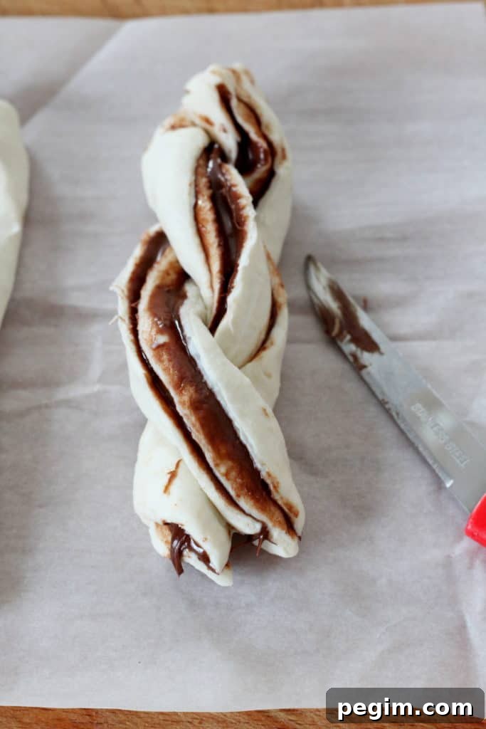 Placed puff pastry twists on baking sheet and brushed with egg wash.