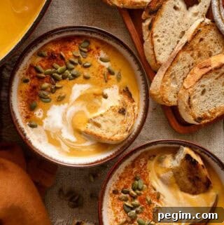 two bowls of sweet potato pumpkin soup.