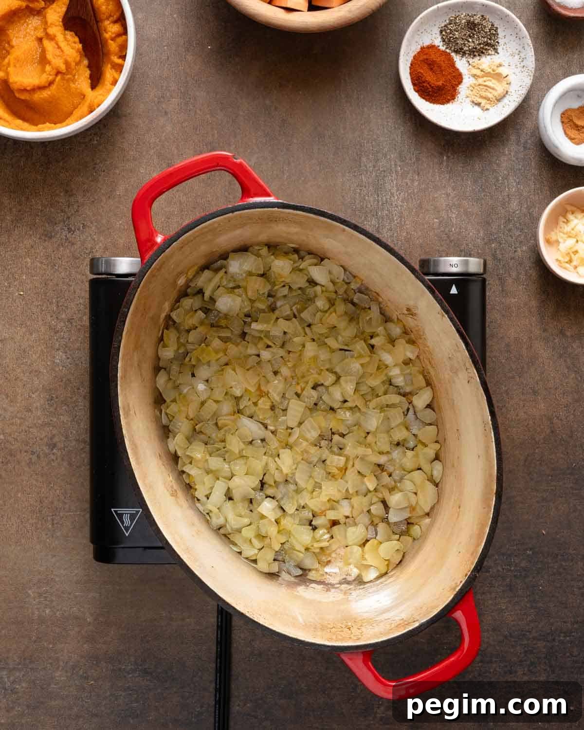 onions cooked in soup pot on burner.