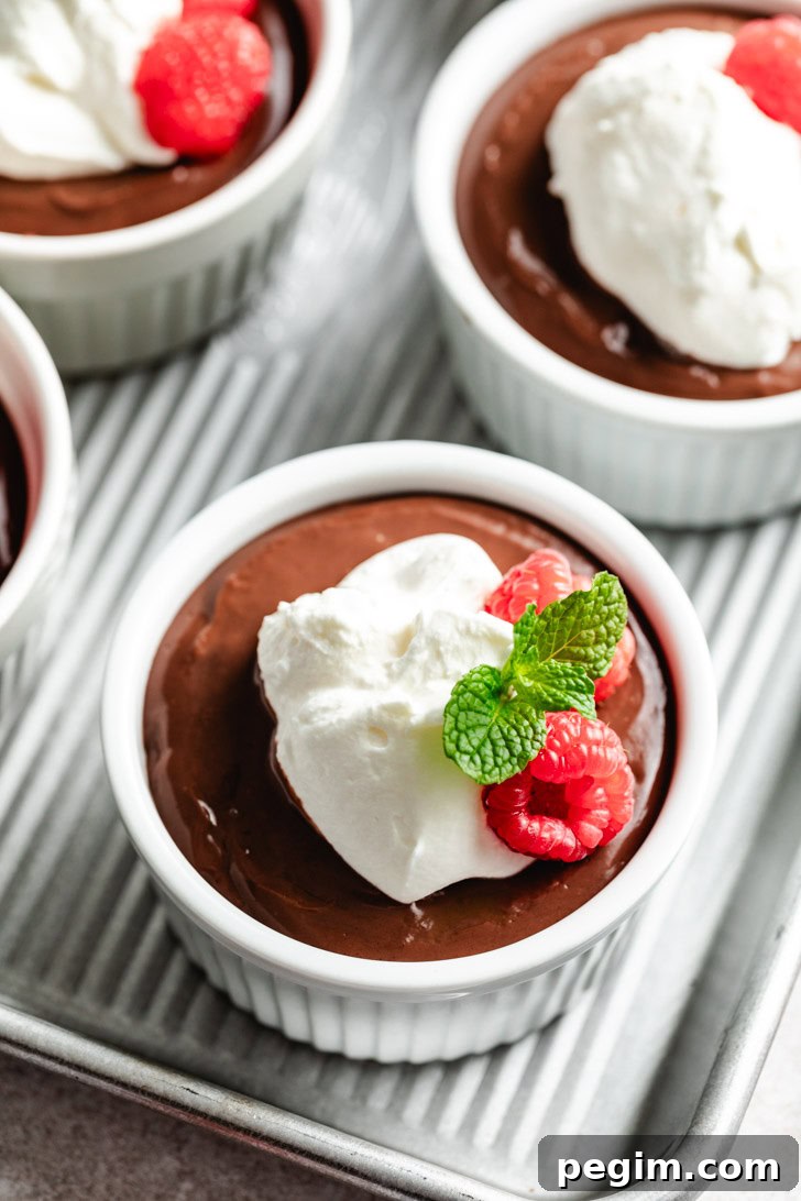 A close-up of a single ramekin with a chocolate dessert.