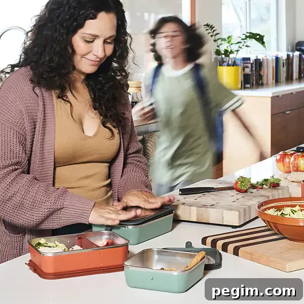 A mother packing her son's lunch with Klean Kanteen bento boxes.