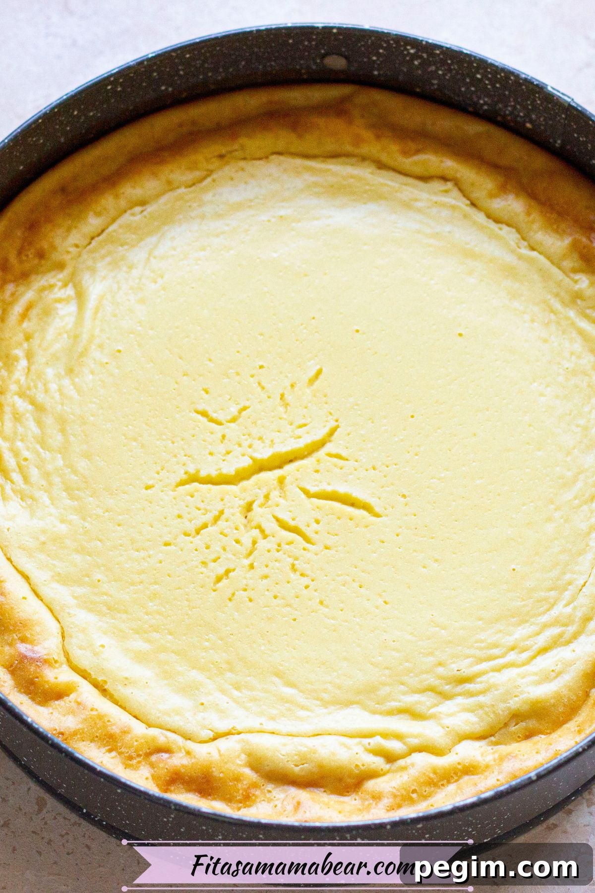 Cheesecake baked in a circular pan.