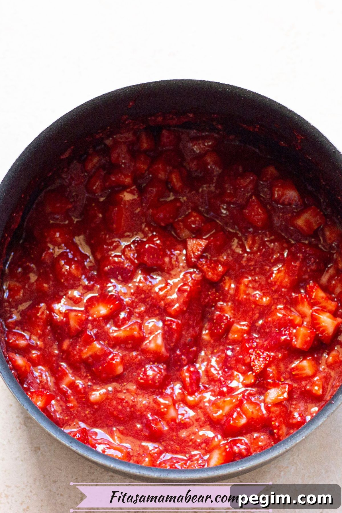 Strawberry compote in a baking pan.