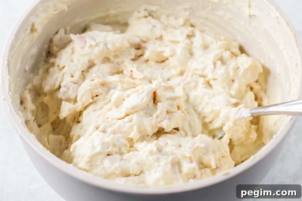 Creamy chicken mixture in a gray bowl.